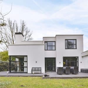 The courtyard of the house in a minimalist style with a lawn